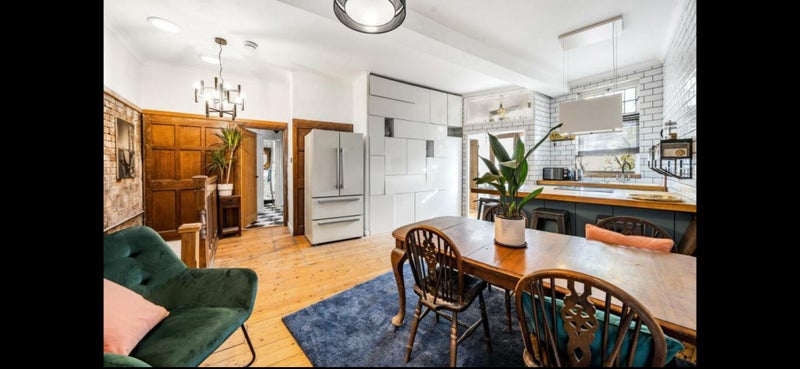 Photo 1: Main kitchen/ dining area