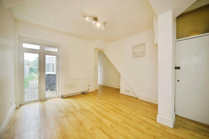 Photo 1: Front room towards garden