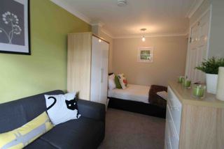 Photo 1: Bedroom with seating area
