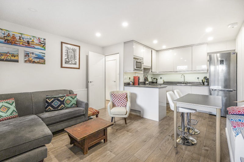 Photo 1: Kitchen + TV area