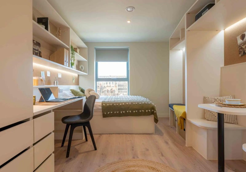 Photo 1: Fully furnished: double bed, desk, sitting nook, dining area