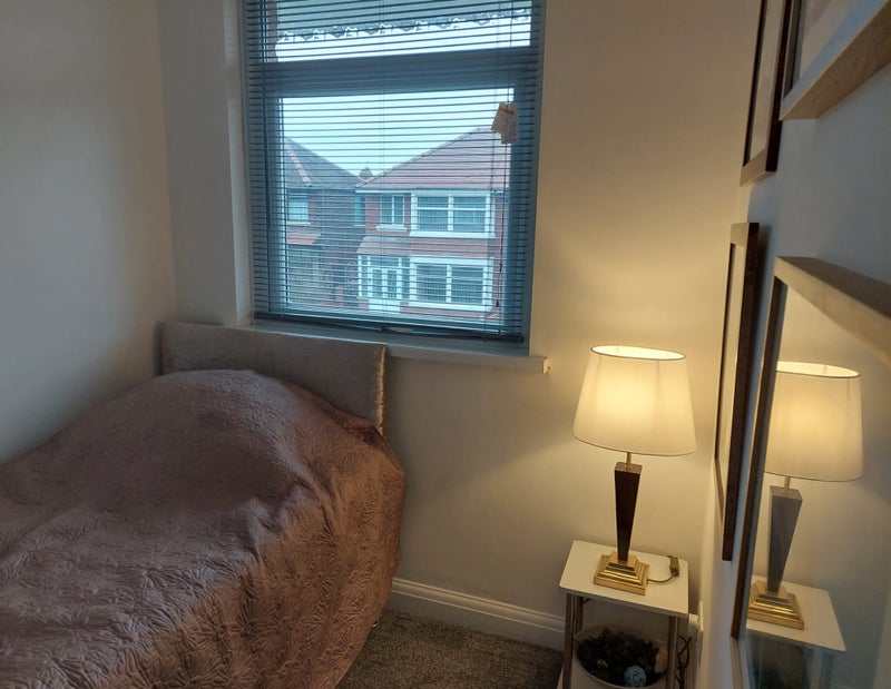 Photo 1: Single brand new bed, table lamp