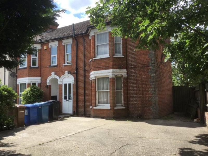 Photo 1: Front with parking