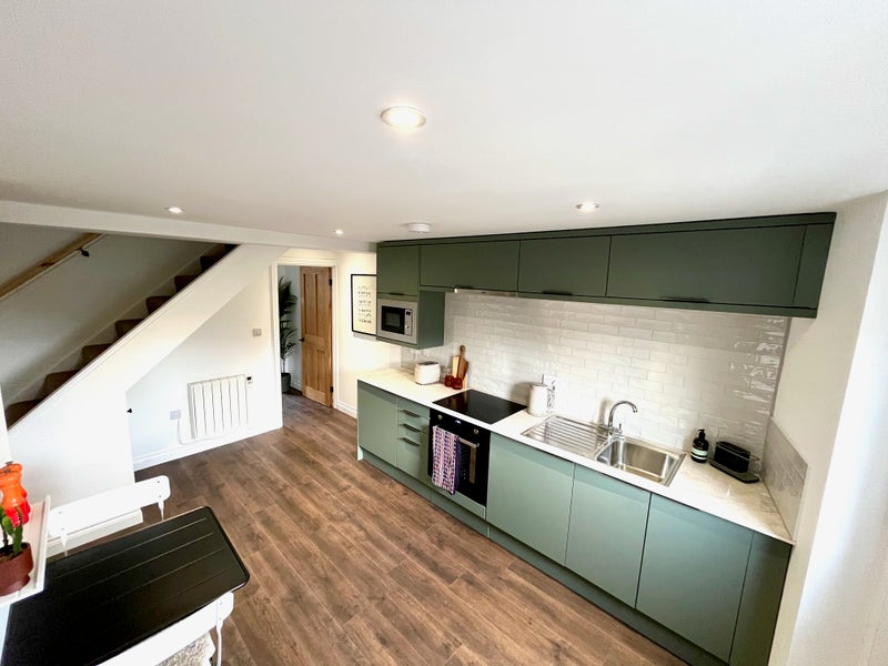Photo 1: Dining kitchen through to front room