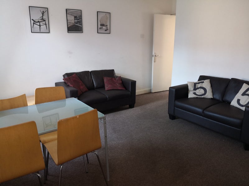 Photo 1: Living /dining room