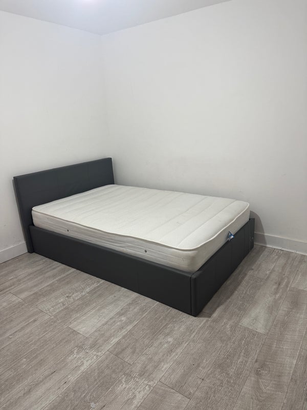 Photo 1: Spacious bedroom with storage under the bed