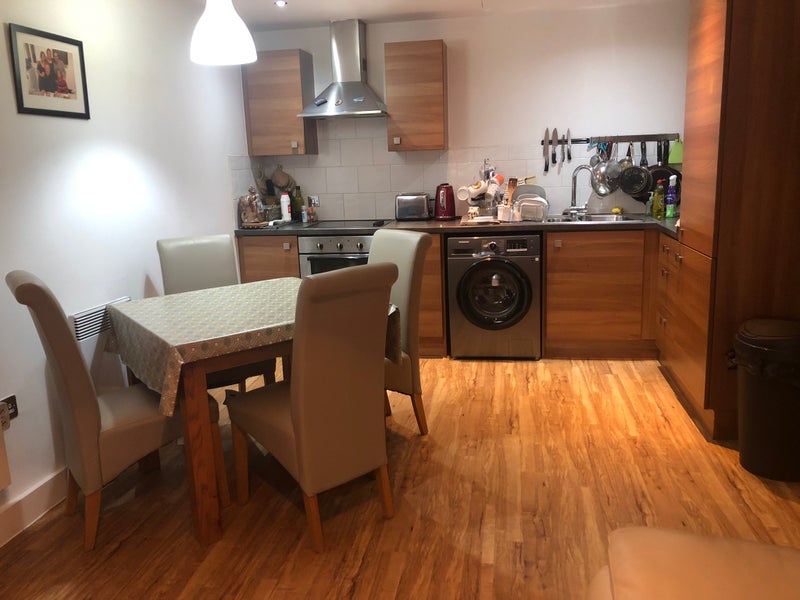 Photo 1: Kitchen and dining area