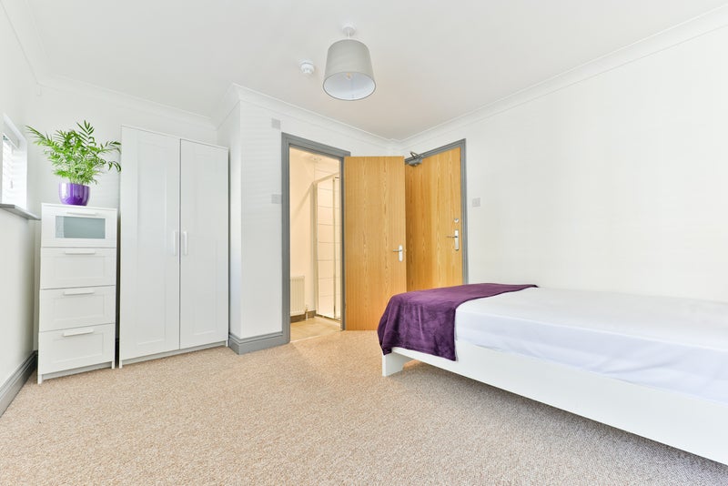 Photo 1: Furnished with a bed, wardrobe, drawers desk and chair