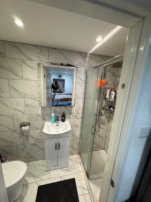 Photo 1: Shower and toilet