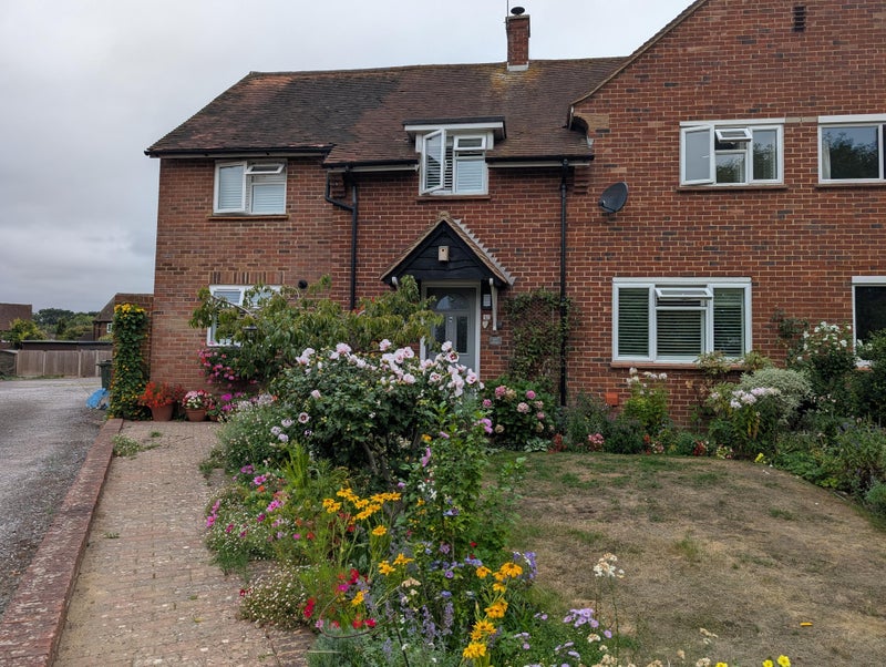 Photo 1: House with parking off street