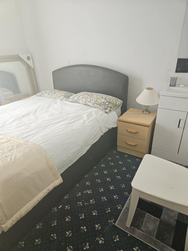 Photo 1: bedroom has sink and own vanity unit