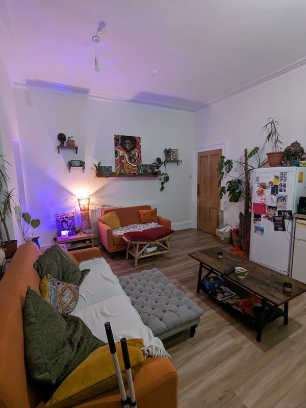 Photo 1: Shared living room/kitchen