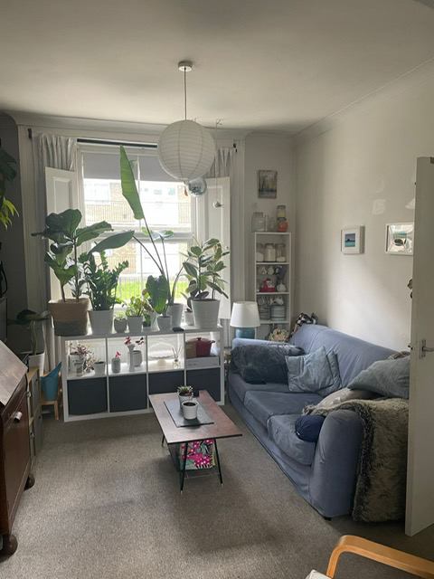 Photo 1: One half of the room facing the street