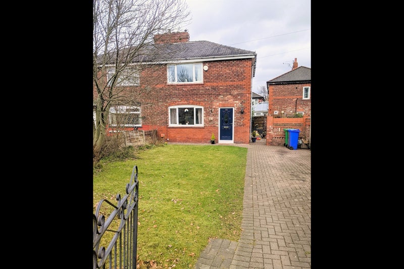 Photo 1: Front of the house, including garden and driveway