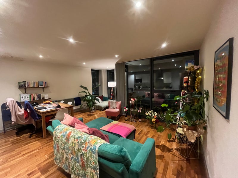 Photo 1: Living Room with Balcony