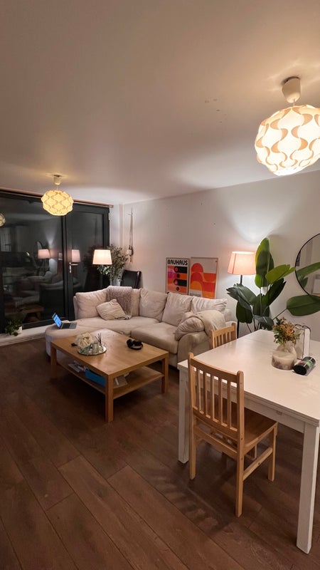 Photo 1: open plan living room and balcony