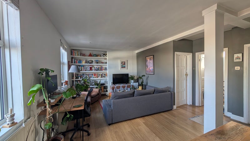 Photo 1: Living room with workstation 