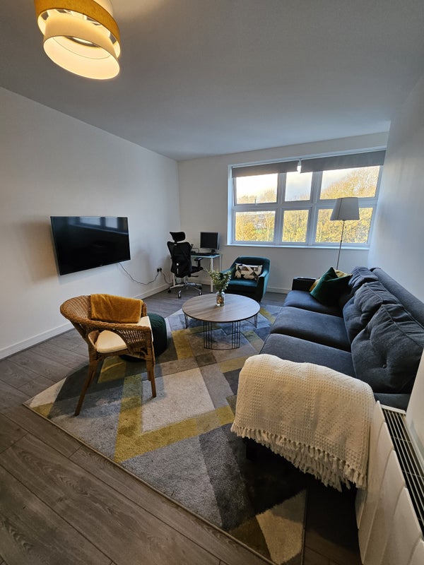 Photo 1: Living Room with 50" TV