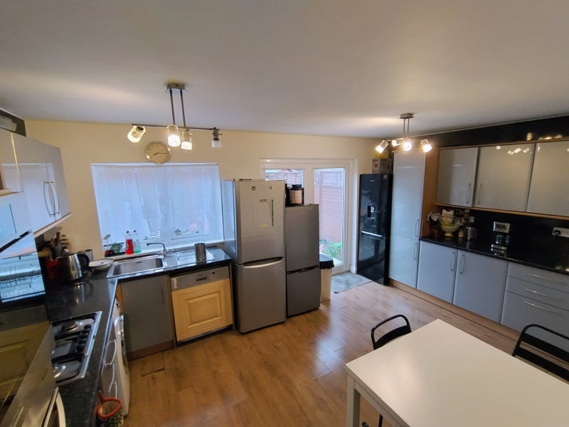 Photo 1: Kitchen/Living area