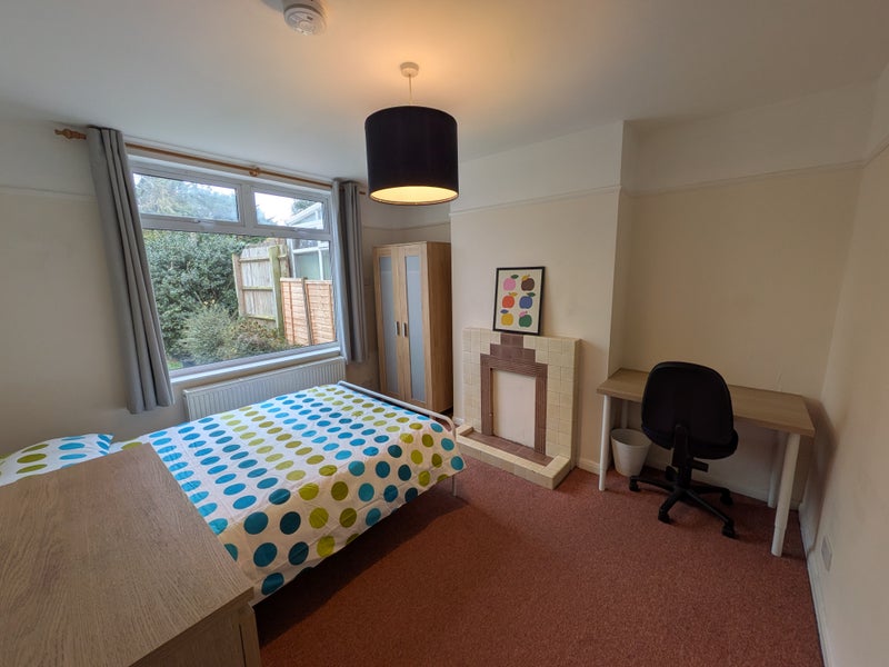 Photo 1: Large Bedroom with garden view