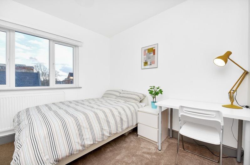 Photo 1: Furnished with a bed, wardrobe, drawers desk and chair