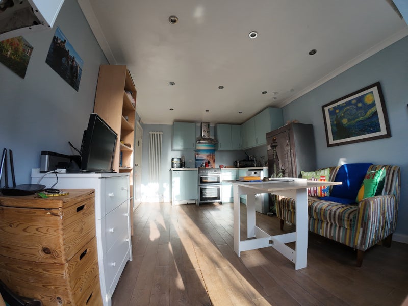 Photo 1: Sitting room/kitchen