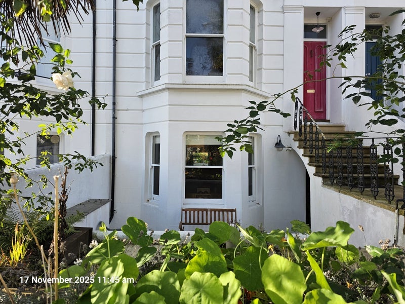 Photo 1: View of front entrance