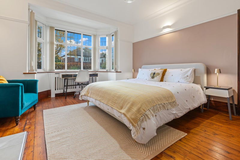 Photo 1: Elegant Bay-Window Bedroom with Seating Area & Super King Size Dusk Bed