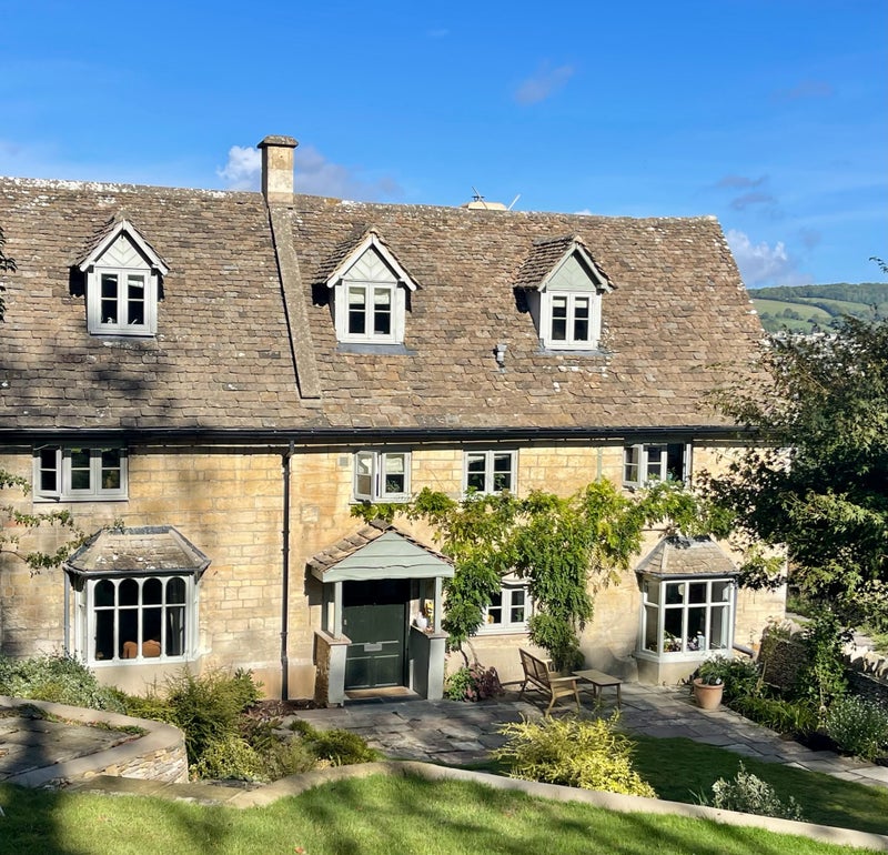 Photo 1: Front of house. Bedroom is on left of top floor.