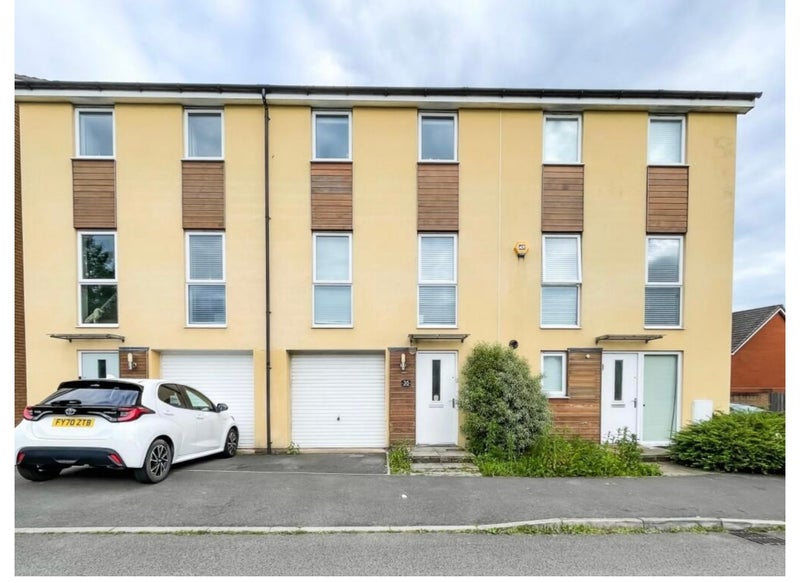 Photo 1: Front with Garage and Parking space