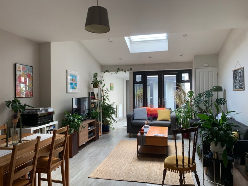 Photo 1: Shared living room/inset patio