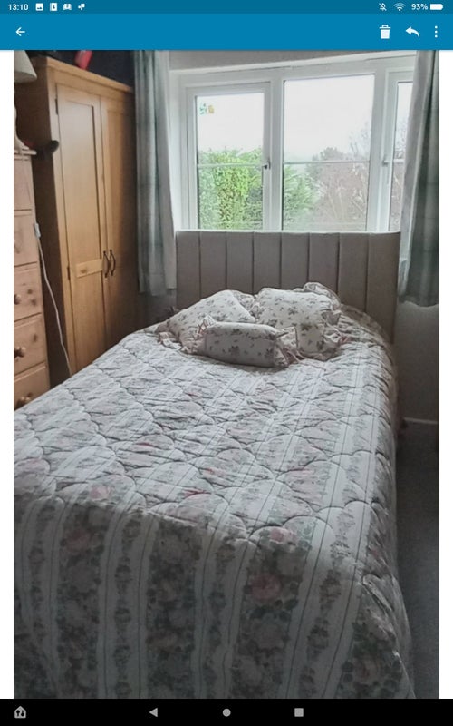 Photo 1: The room is large with a double bed and plenty of storage space.