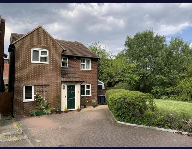 Photo 1: Front Elevation and Parking