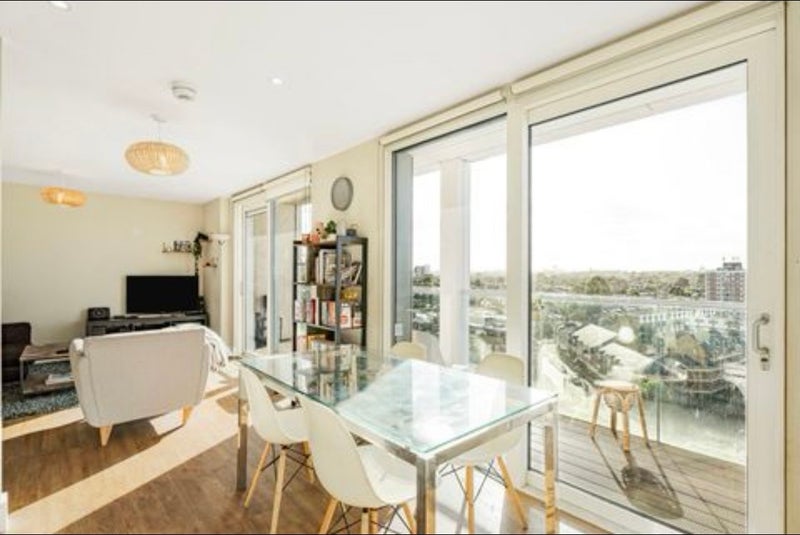 Photo 1: Living space with full length balcony 