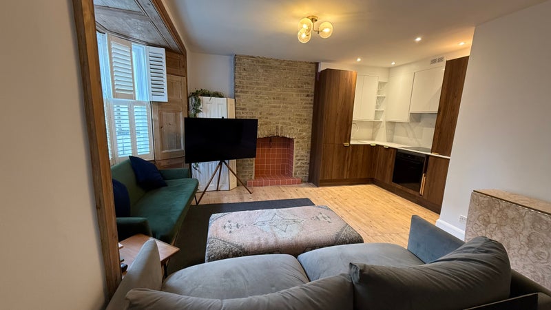 Photo 1: Living room and kitchen view 1