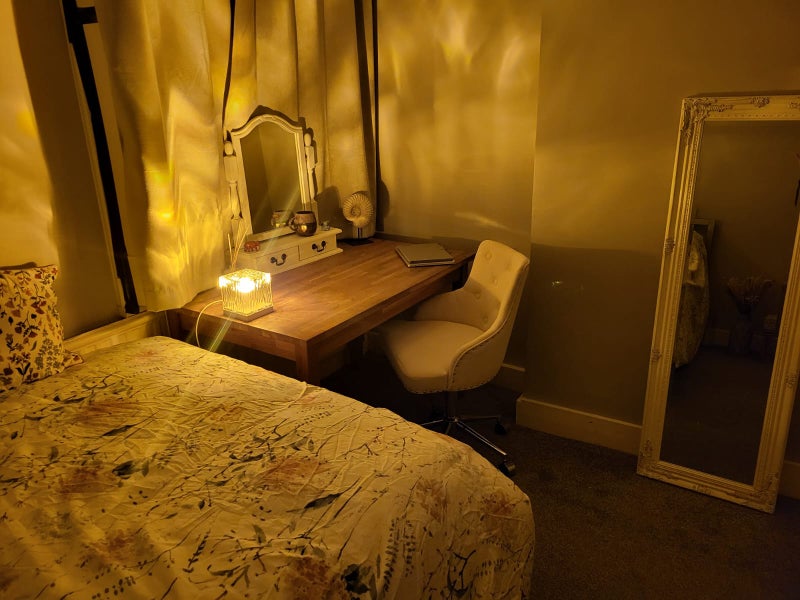 Photo 1: the room includes double bed, desk, chair, built in wardrobe/storage.