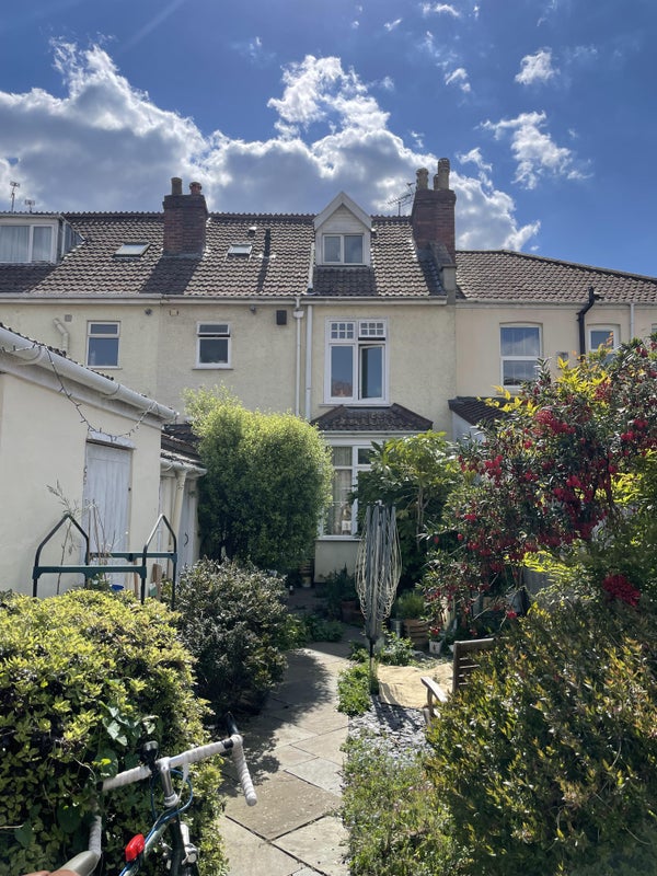 Photo 1: The back of the house from the garden