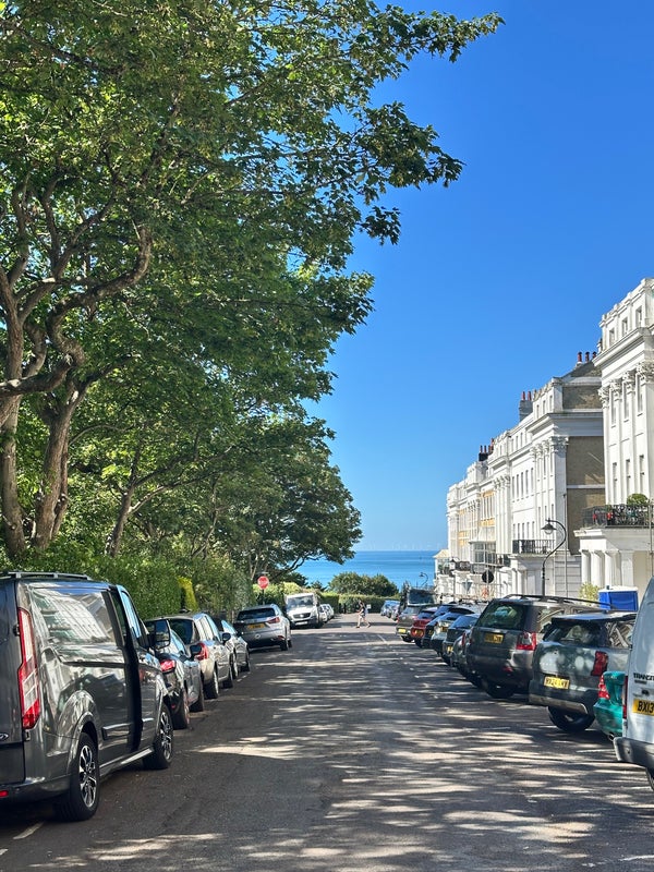 Photo 1: The street and square, with close proximity to the beach