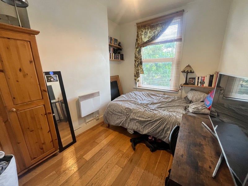 Photo 1: Room w/ double bed.