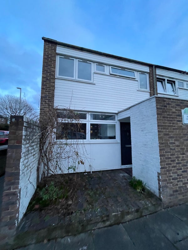 Photo 1: Front of house, at the end of the street