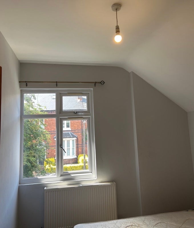 Photo 1: Curtains have since been put up but they are slightly too short  