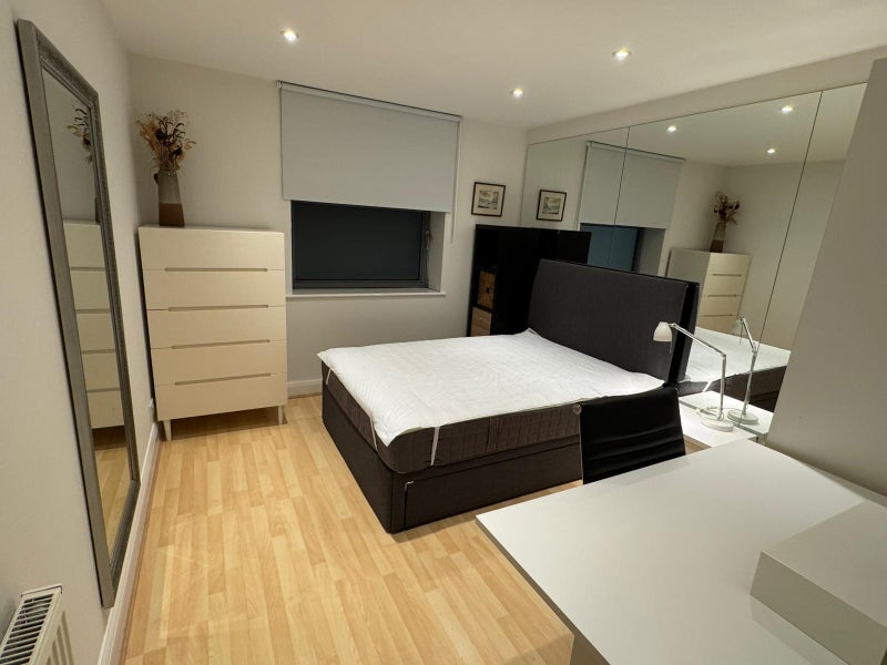 Photo 1: Double room view 1 - drawer storage bed, big chest of drawers, shelves, mirror
