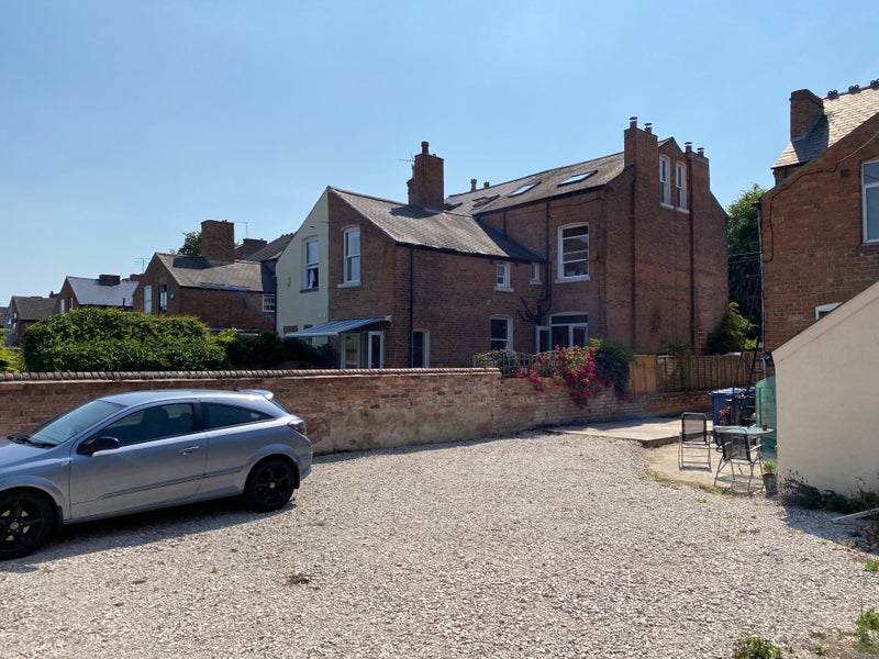 Photo 1: Off street parking 