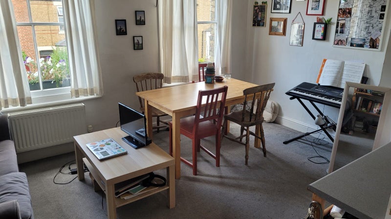 Photo 1: Living room shared by the two bedrooms