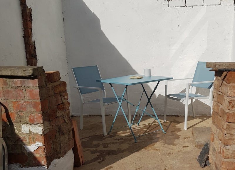 Photo 1: Covered rear seating area with double electric sockets