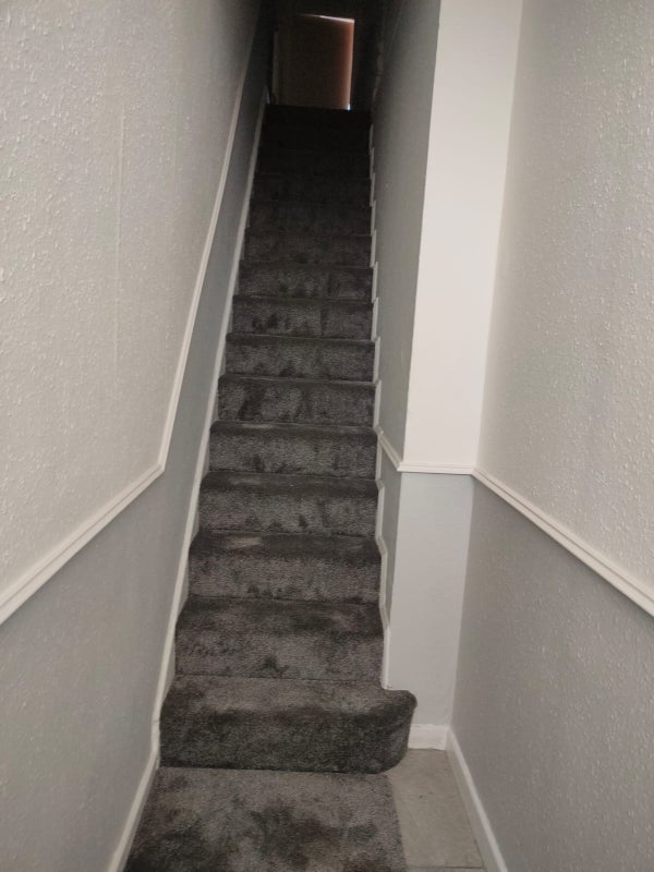 Photo 1: Hallway n stairs to 1st floor