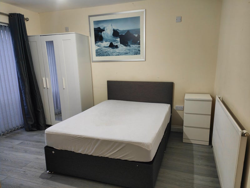 Photo 1: Back downstair room looking onto garden