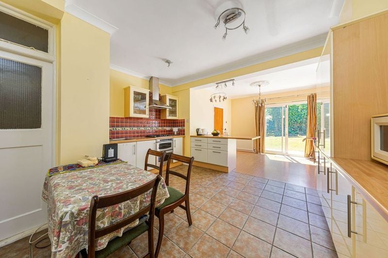 Photo 1: Kitchen and living area