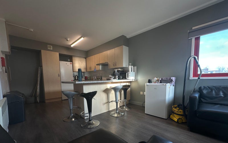 Photo 1: Shared kitchen & common area