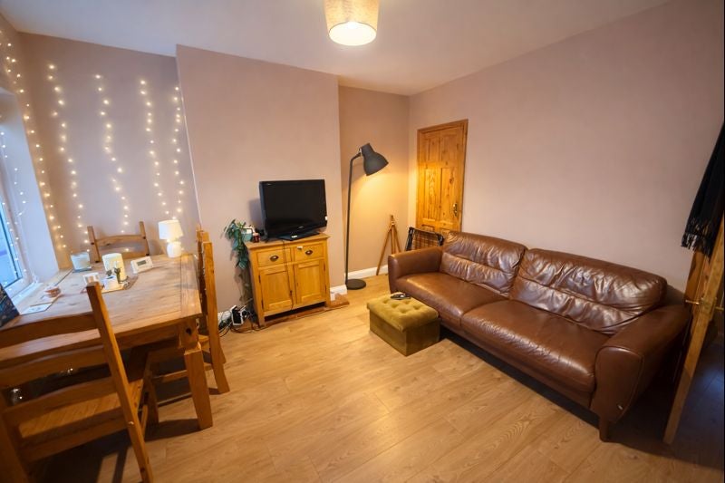 Photo 1: Communal living/dining room